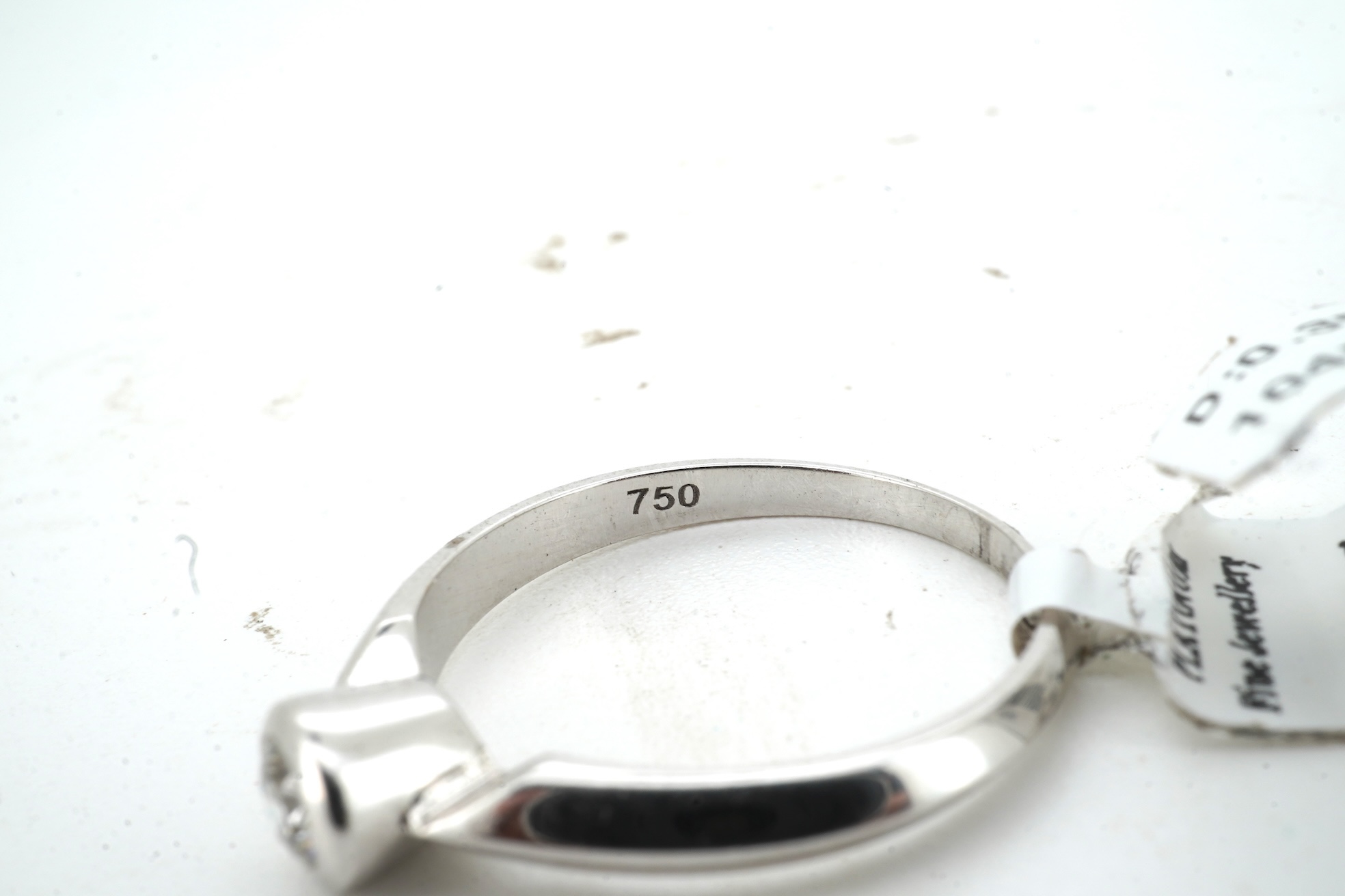 A diamond ring, collet-set with a brilliant-cut diamond weighing approximately 0.35 carats, mounted in 18ct white gold, size M, British hallmarks, gross weight approximately 2 grams